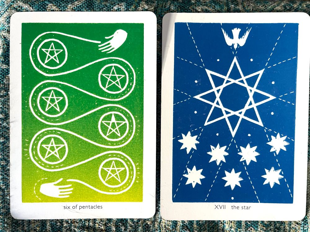 two tarot cards: the 6 pentacles and the star