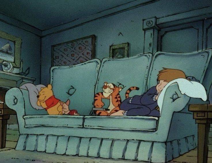 Winnie the Pooh, Piglet and Christopher robin lounge together on the couch to take a cozy nap while tigger changes the channel on the tv. 
