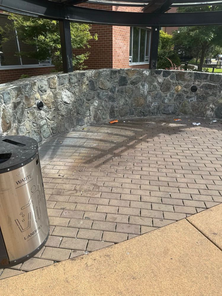 A smoking area outside of RJH. The garbage can remains but the sitting benches have been removed.