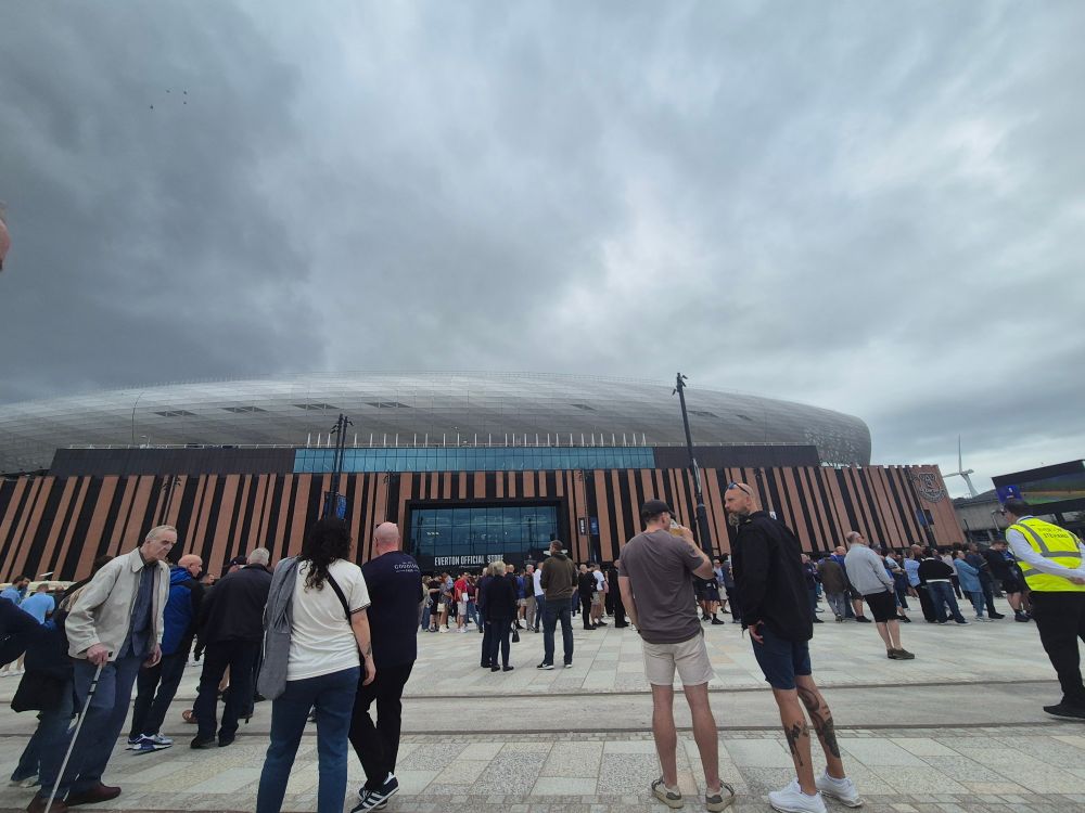 Image of fans standing on the fan plaza outside the Hill Dickinson Stadium 