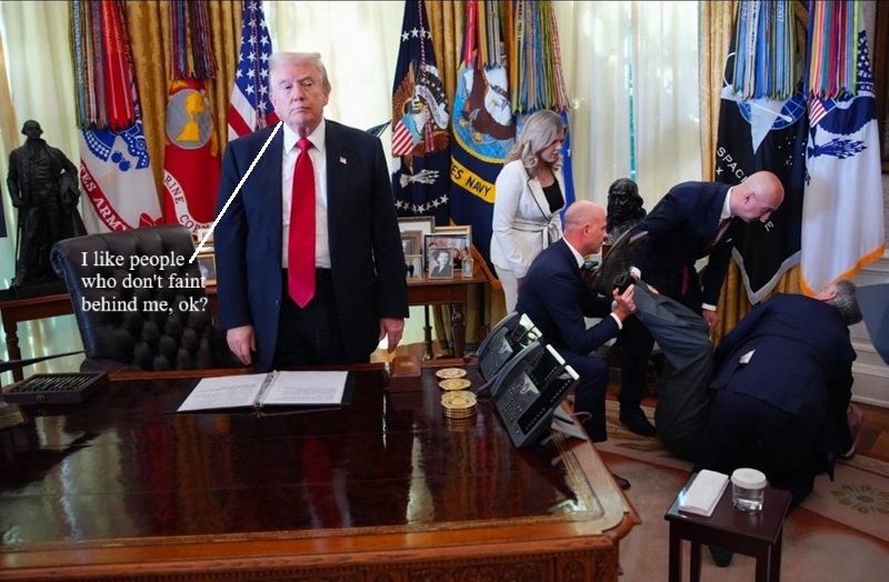 Convicted felon standing up in front of desk staring blankly, completely devoid of empathy of man who fainted behind him.