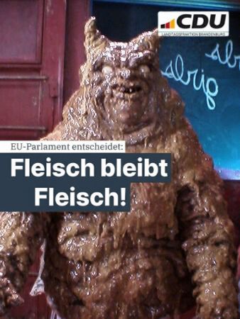 Der Golgathaner aus Dogma, ein Dämon der aus Scheiße besteht. Darauf Logo der CDU Brandenburg und Text: EU-Parlament entscheidet: Fleisch bleibt Fleisch!