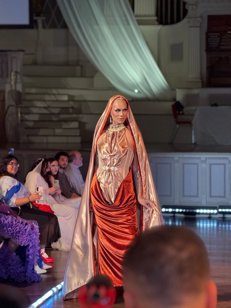Raja walks the final piece in a collection by Utica for the QueerAF fundraiser. 