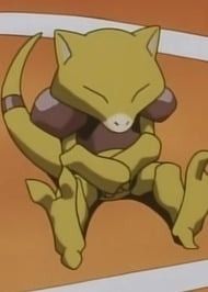 The Pokemon Abra sitting down