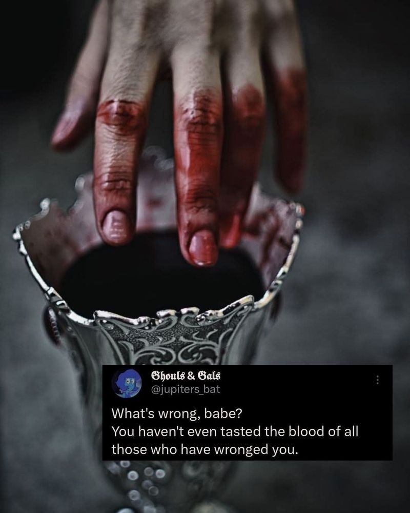 Pic of a hand dipping into a silver goblet willed with blood 