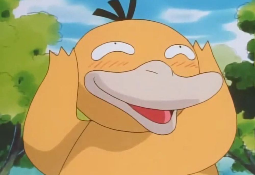 psyduck from pokemon blushing with paws up and a big smile
