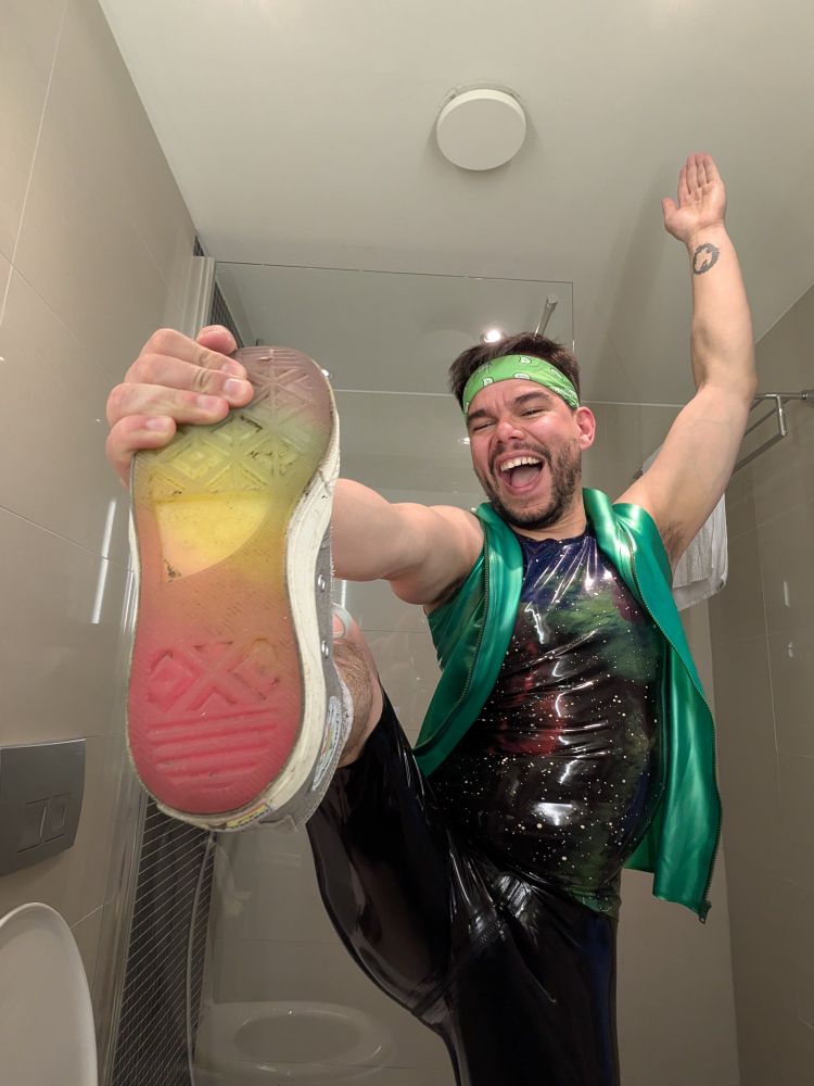 Guy wearing bright rubber and silver converse sneakers 