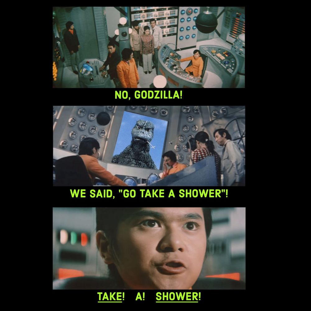 A team of scientists in a high tech command center communicate with Godzilla over a video screen, saying "No, Godzilla! We said 'Go take a shower'! Take! A! Shower!"