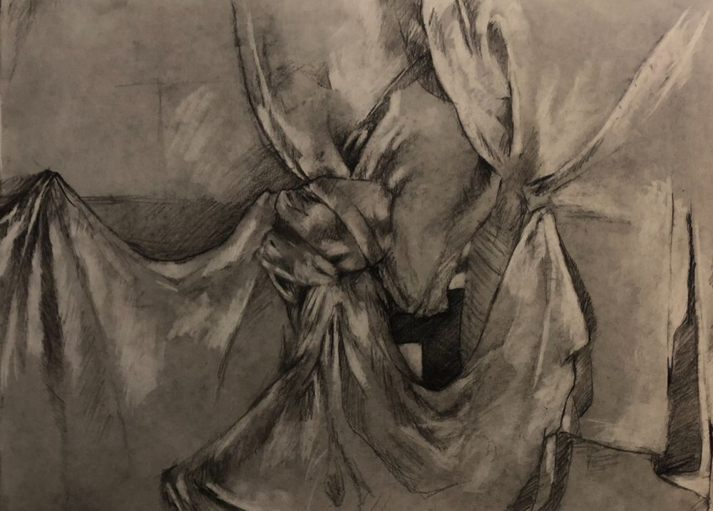 A still life of a folded and knotted cloth 