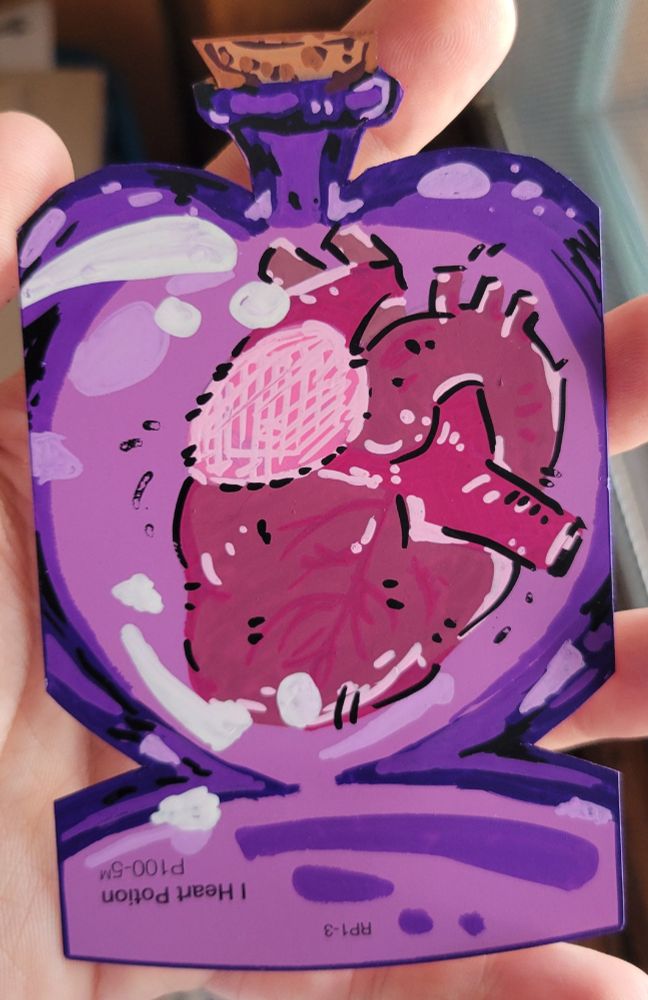 A purple paint chip with an illustration of an anotomical heart in a potion bottle that uses the paint chip color as part of the illustration