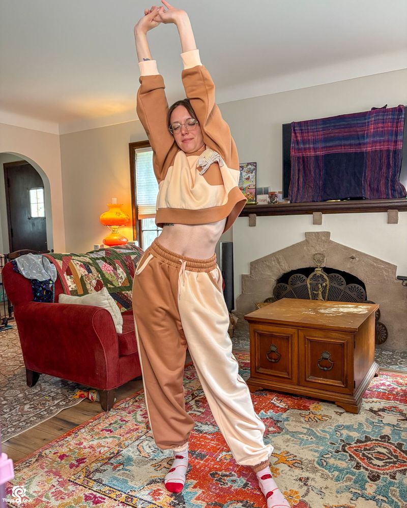 devin wearing the new teddy set. both pieces are in size small. when the arms are raised, their bra is still covered