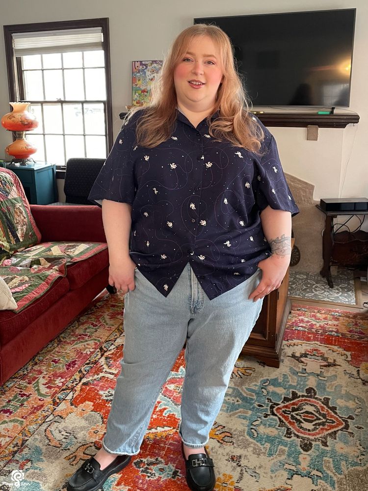 maya wearing the astronauts button-up in size 3xl