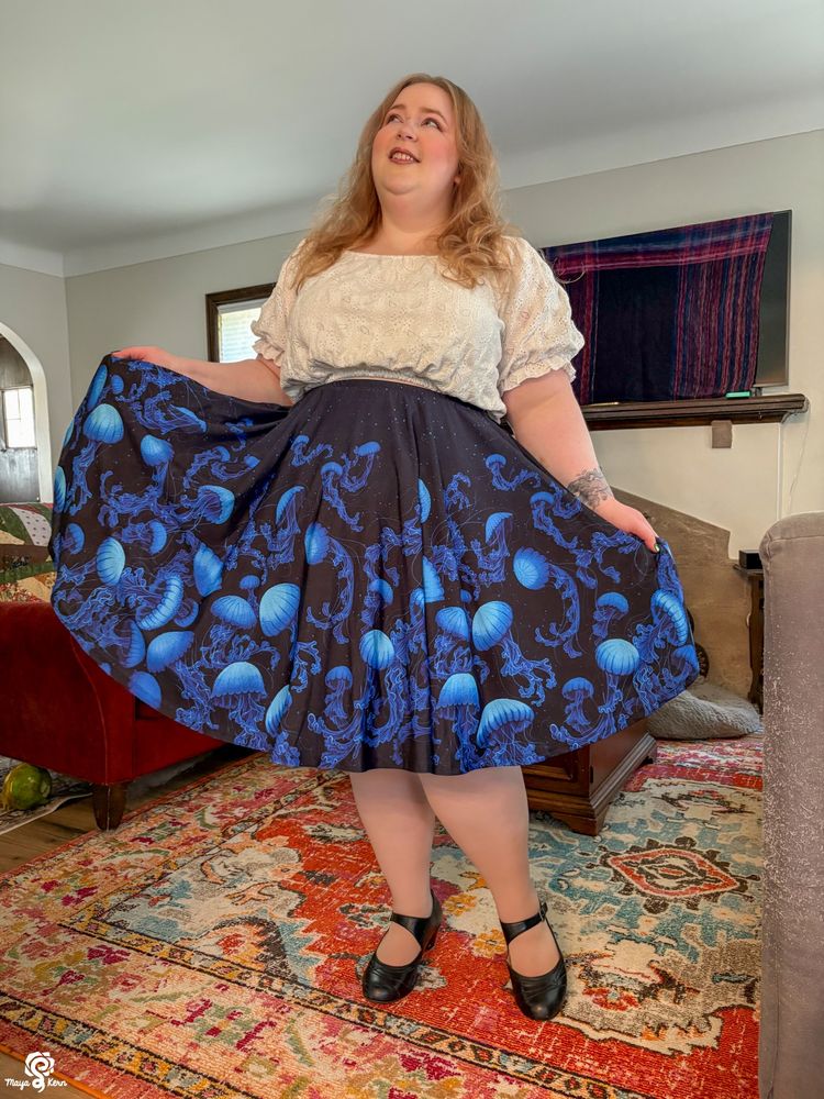 photo of a plus size woman wearing a skirt with jellyfish on it