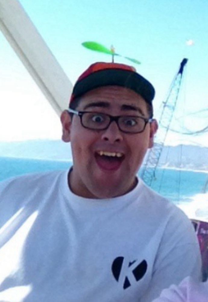 Goofy looking f word wearing a propeller cap.