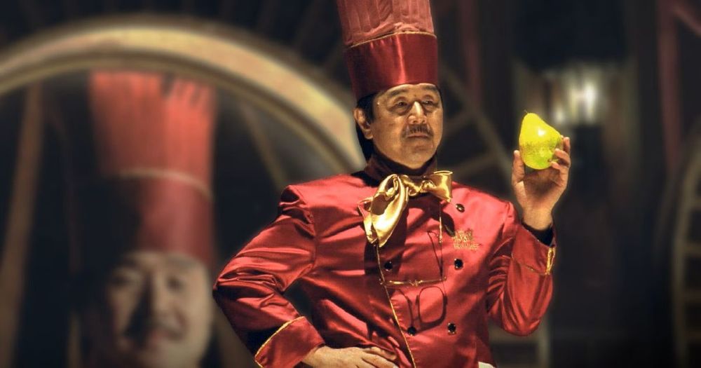 Iron Chef French Hiroyuki Sakai holding a pear