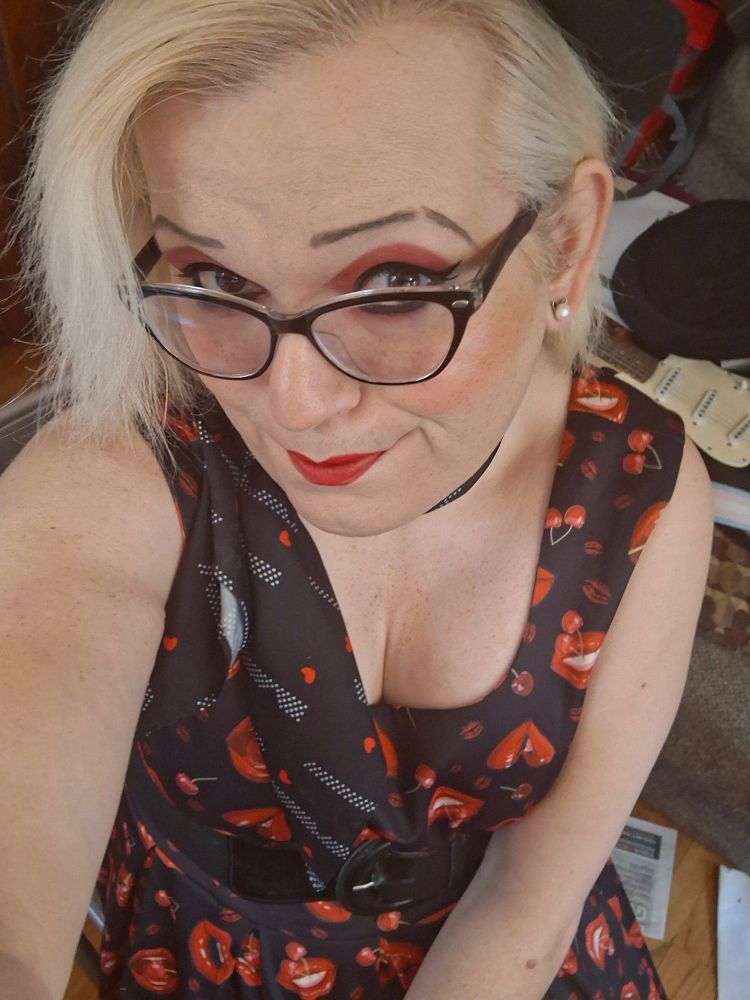 A close-up selfie with cleavage