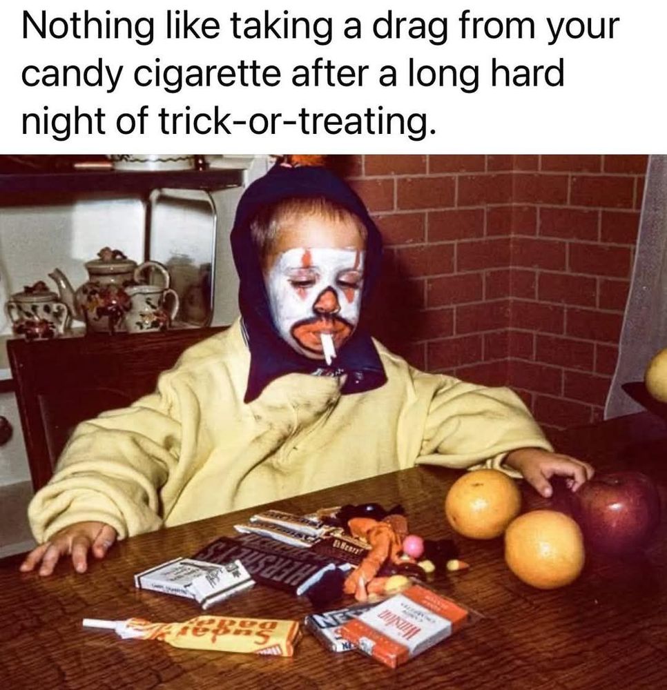 A kid in a Halloween costume sitting at a table with Halloween candy and fruit. He has a candy cigarette dangling from his mouth. The text reads, "Nothing like taking a drag from your candy cigarette after a long, hard night of trick-or-treating." Don't smoke, kids. It's bad for you.