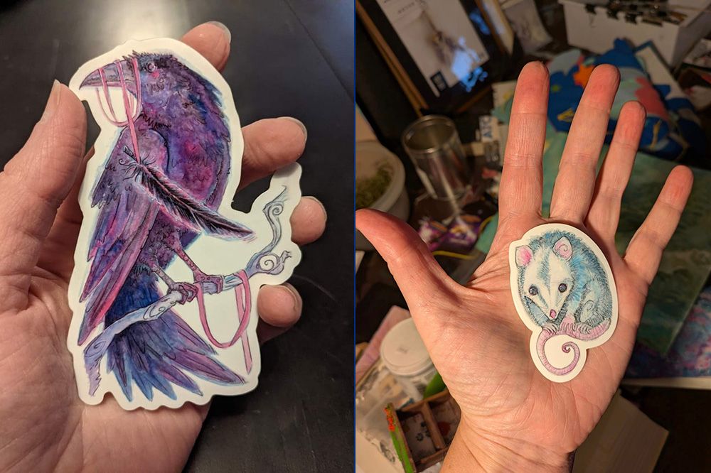 stickers! one is a big purple raven, the other is a cute possum.