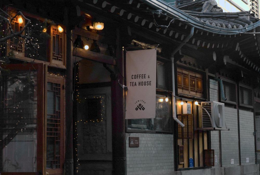 Korean traditional house converted into a cafe with a sign that says “coffee and tea house”