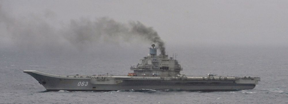 Aircraft Carrier "Admiral of the Fleet of the Soviet Union Kuznetsov" puffing out black smoke from burning mazut