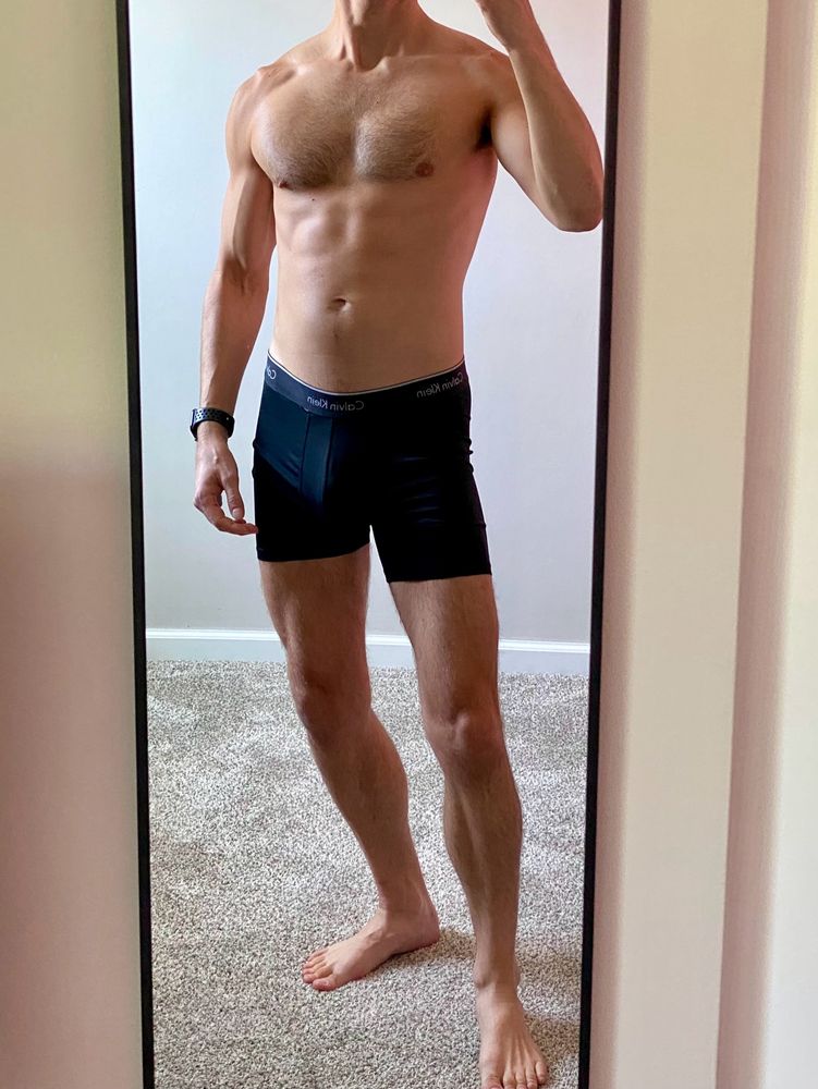 A man wearing only boxer briefs.