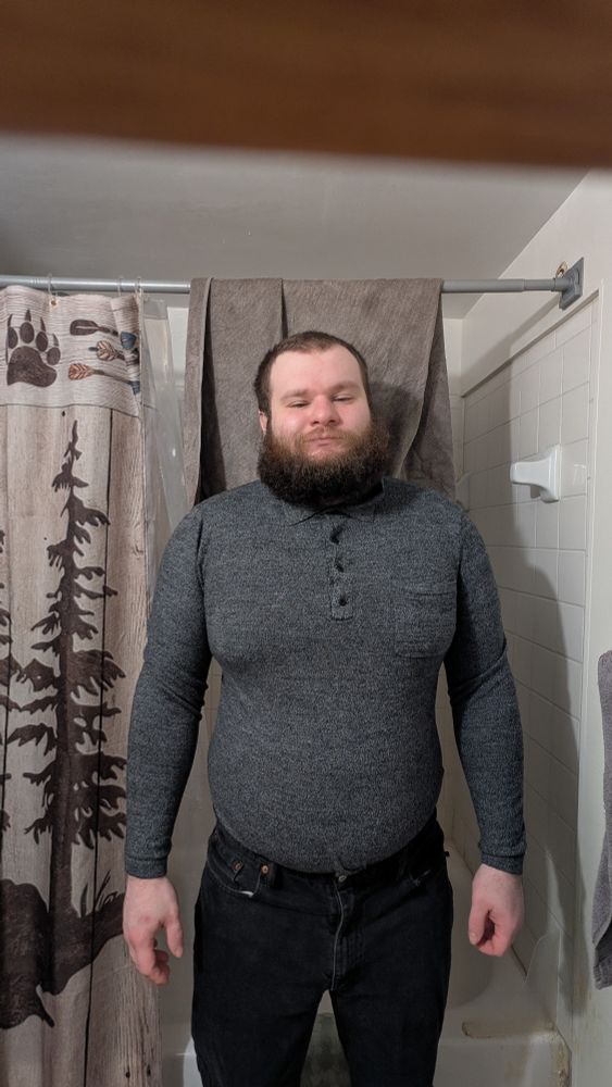 Clothed Cub in a tight shirt and jeans.