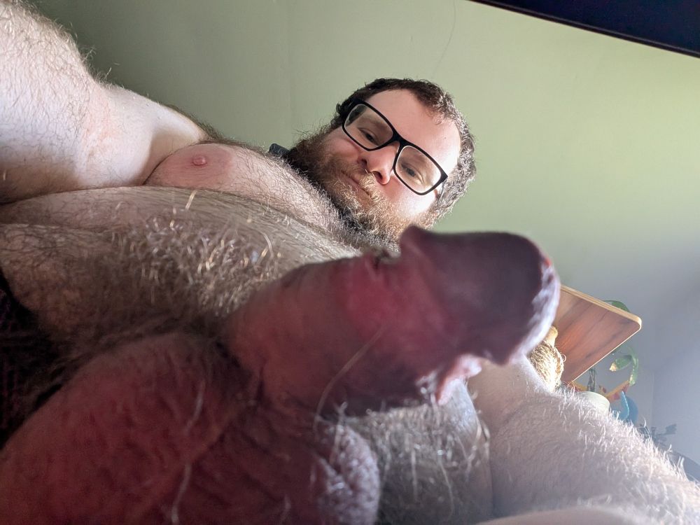 Smirking cub with semi hard cock and balls.