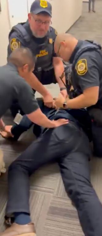 Photo of Senator Alex Padilla, being handcuffed on the ground after approaching Sec. Kristi Noem.