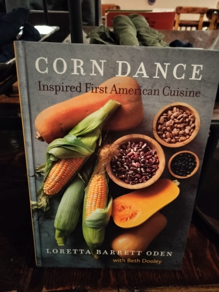 A colorful book cover for "Corn Dance Inspired First American Cuisine"