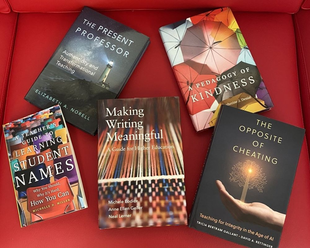 Five books arrayed on the red sofa in the OU Press conference room.