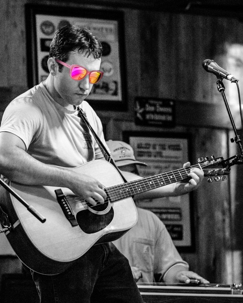 The same photo with some silly sunglasses photoshopped on his face. 