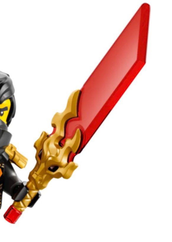 A minifigure of cole holding a reveal blade piece