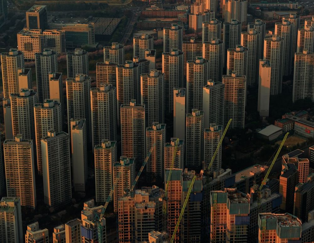 High-rise buildings stand tightly together in a city.