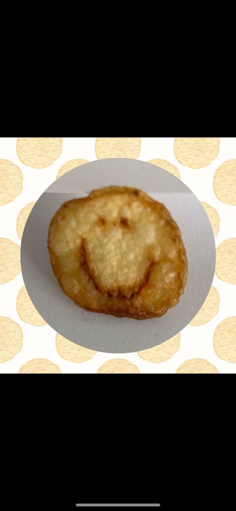 A potato chip with a smiley face on it 