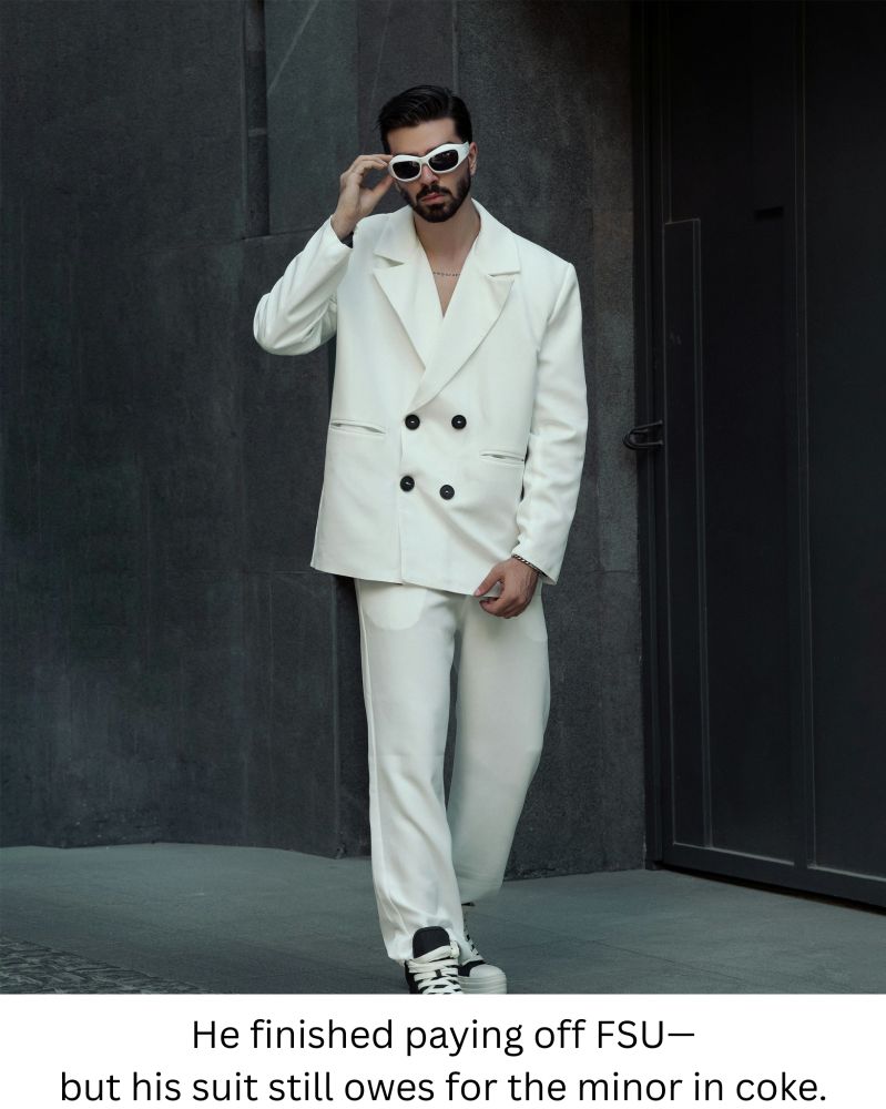 Young guy dressed in all white linen suit and white sunglasses.