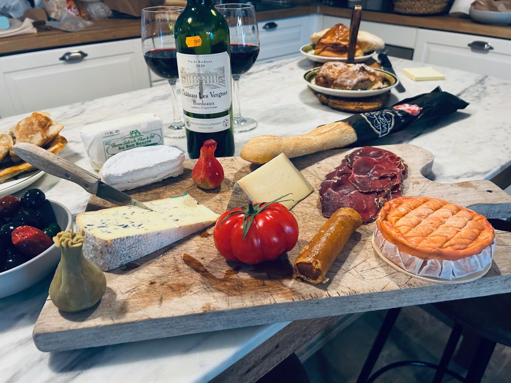 Wine, cheese (so much cheese), the perfect tomato, some specialty charcuterie meats, bread, olives and pastries at our AirBnB in Paris. A delicious feast in the City of Lights. 