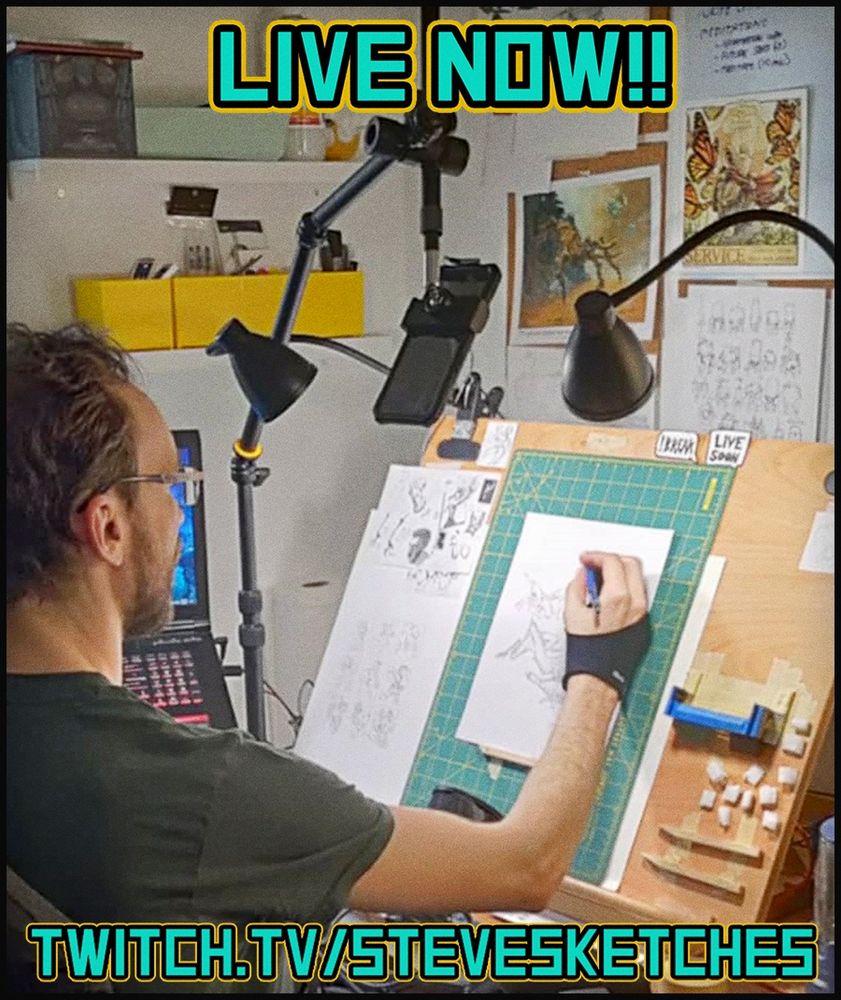A shitty photo of my at my desk doodling for dollars.  Text says " LIVE NOW!! " and " TWITCH.TV/STEVESKETCHES " 