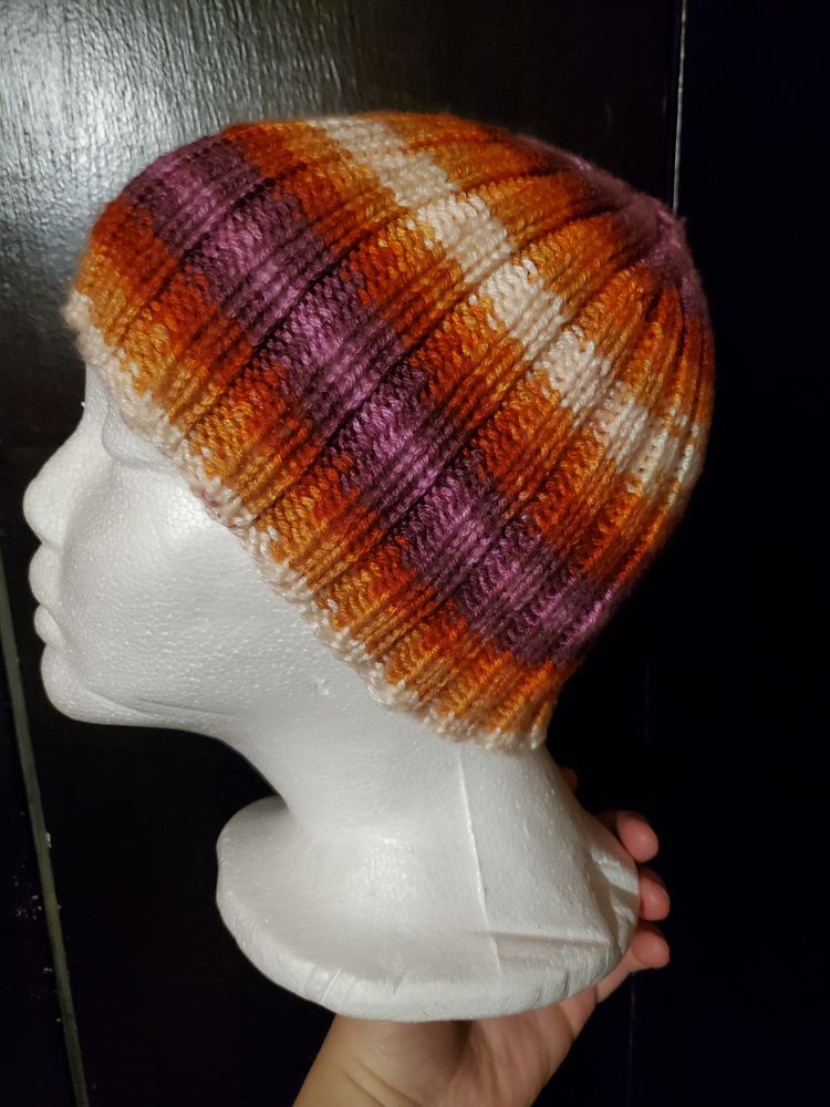 Photo of the same beanie on the foam head but a side view