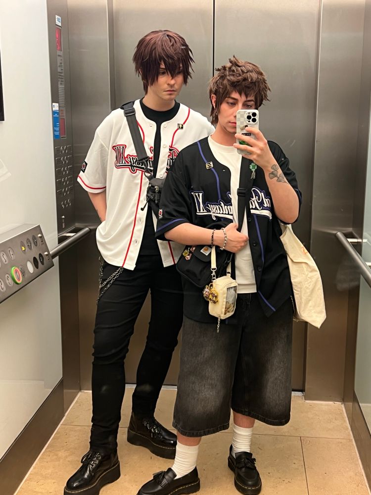 mirror selfie of two regular guys in very cool ff14 baseball jerseys
