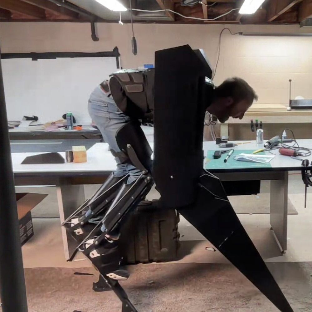 A puppeteer building and testing a full size, quadruped robot costume.