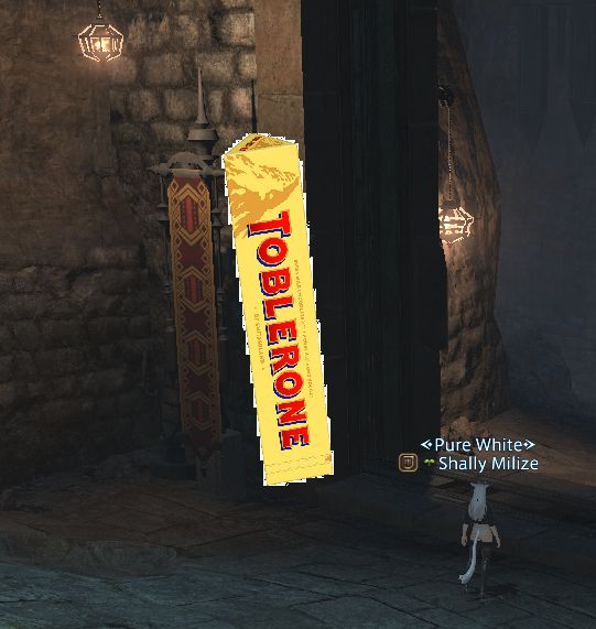 A picture of the Toblerone chocolate box (right) next to an ingame banner (left) that, according to Shally, looks literally the same.