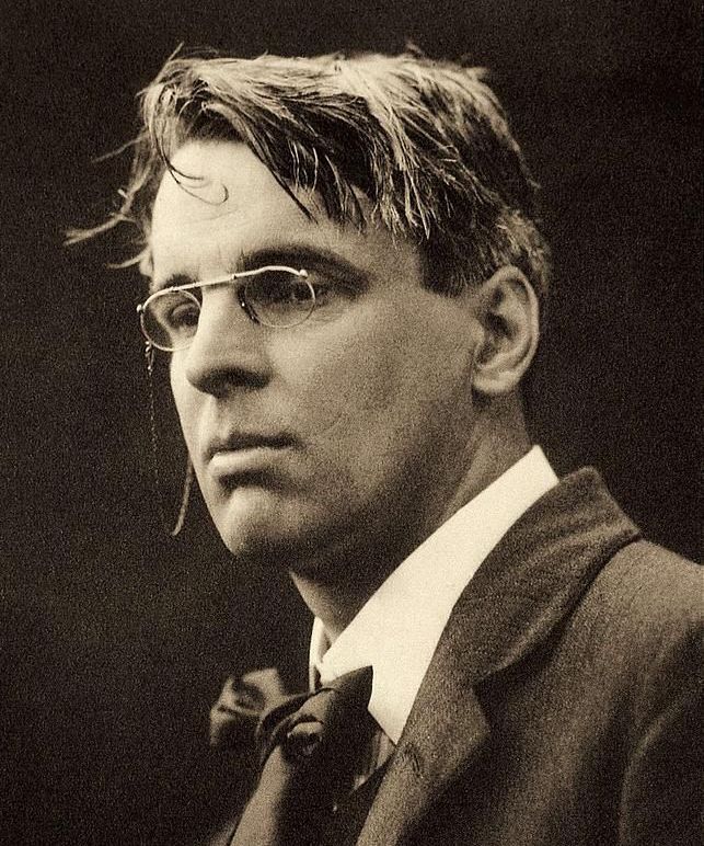 Head and shoulders photograph of W.B. Yeats with glasses and slightly disheveled hair