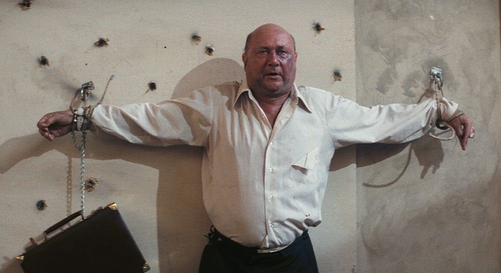 The president tied to a wall in Escape From New York.