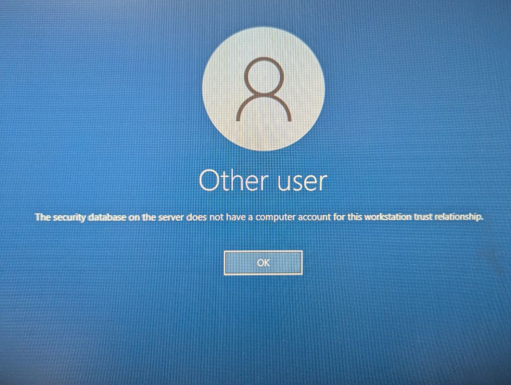 Blue computer screen with white text that says "The security database on the server does not have a computer account for this workstation trust relationship."