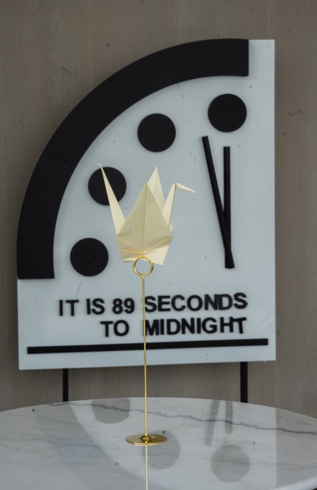 Logo for the assembly in front of the Doomsday Clock