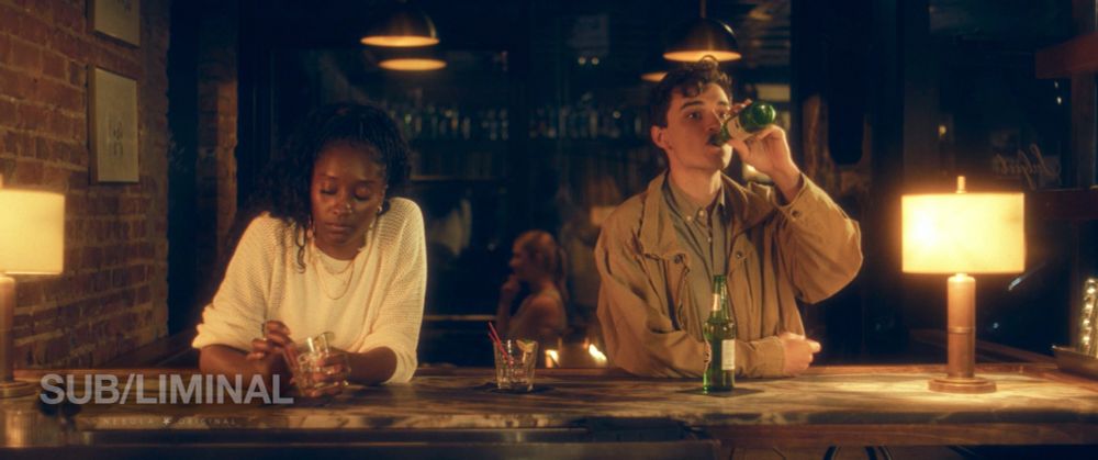 Two people at a bar