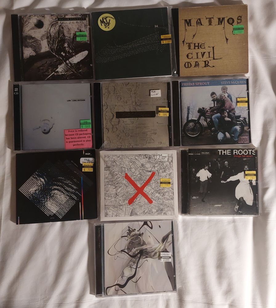 10 CDs I bought from Amoeba Music, San Francisco.

Top row: David Sylvian – Secrets of the Beehive, Oval – 94 diskont, Matmos – The Civil War

Second row: Low – Long Division, Low – Things We Lost in the Fire, Prefab Sprout – Steve McQueen

Third row: Oneohtrix Point Never – Returnal, Richard Dawson – 2020, The Roots – Things Fall Apart

Bottom: Autechre – Draft 7.30