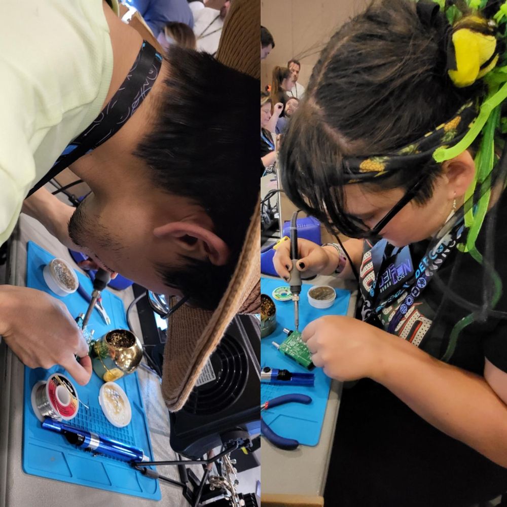 Two people soldering