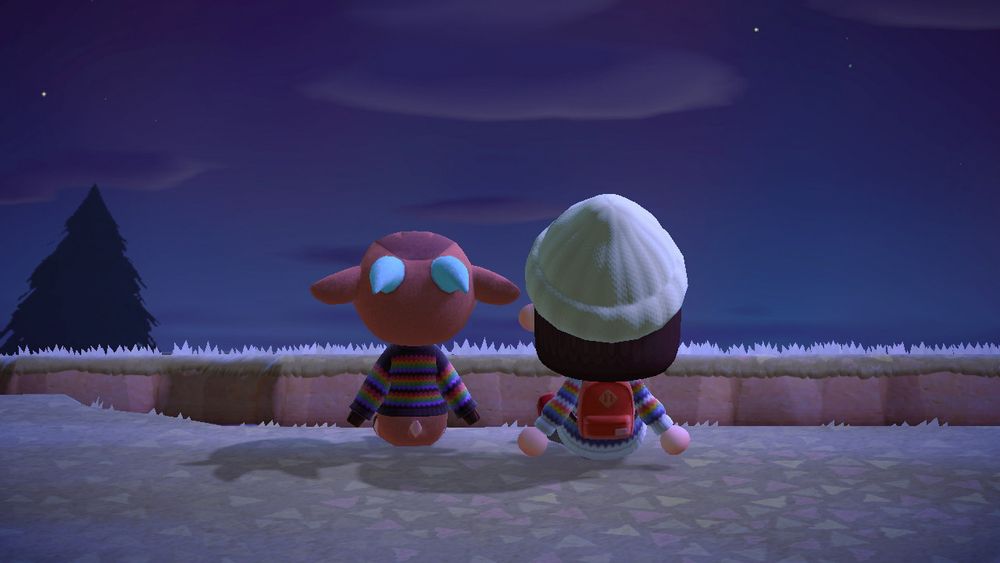 my animal crossing character sitting by the river with pashmina looking at the sky. we are both wearing rainbow striped sweaters.