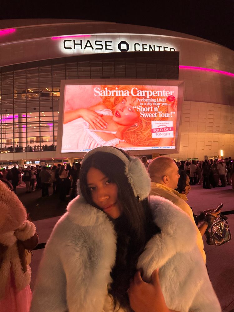 woman attending a Sabrina Carpenter concert 